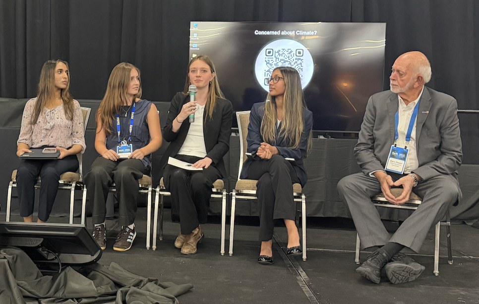 Five panelists on stage at EarthX 2026: four young leaders and Past Rotary International President Barry Rassin